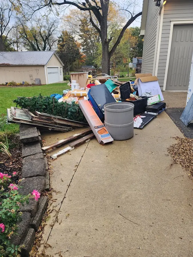 Dumpster being loaded with debris for Commercial Dumpster Rental in Sandy Springs